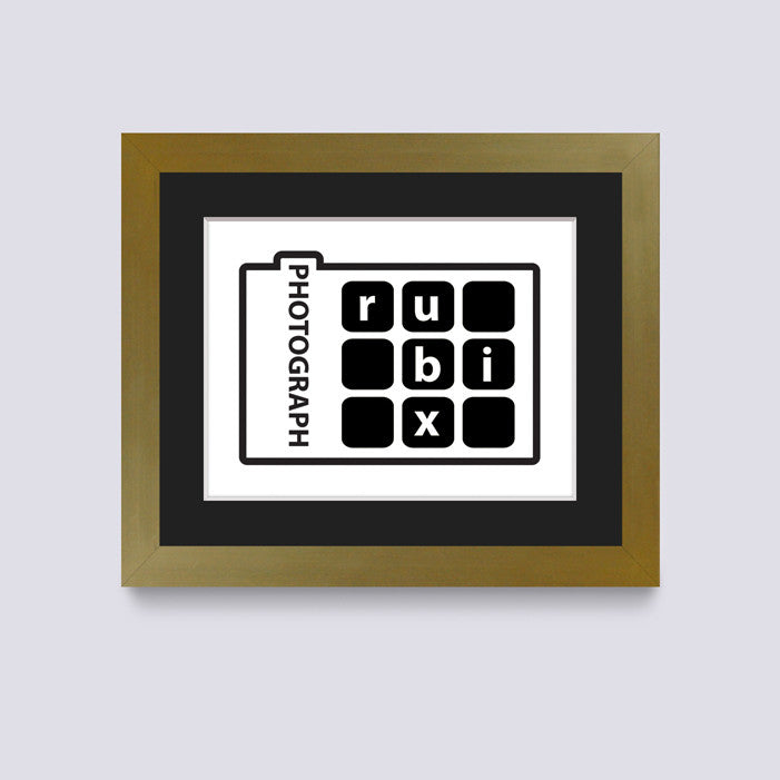 gold photo frame with black mount